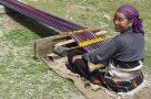 Weaving using a traditional backstrap loom