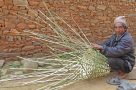 Proud basket weaver on a village walk