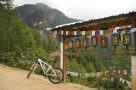 Prayer wheels and view of Tiger's Nest Monastery