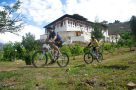Cycling past Paro Dzong in Bhutan