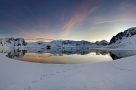 Sunset over the icy Antarctic landscape